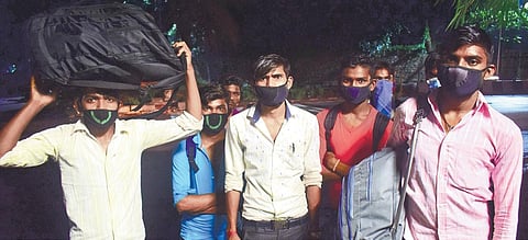 Desperate labourers set out on foot for their hometowns in Uttar Pradesh from Bengaluru on Wednesday evening after trains, which were scheduled to ferry migrant workers to their respective states, were cancelled | PANDARINATH B