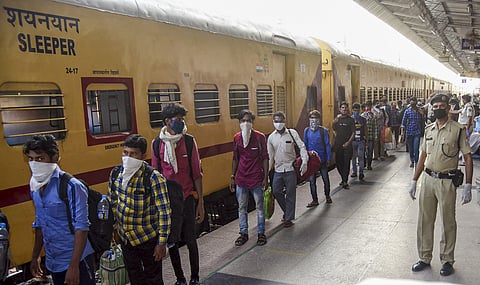 File photo of stranded migrants who arrived by a special train from Kerala follow social distancing norms as they prepare to leave the Danapur Station amid COVID-19 lockdown in Patna Monday May 4 2020. (Photo | PTI)