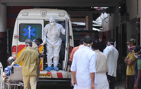 (Image used for representation) An MCH official coming out of the ambulance which carried a patient to the general hospital in Kochi.(Photo | A Sanesh, EPS)