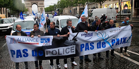 French police unionists demonstrate with a banner reading'No police, no peace' on the Champs-Elysee avenue near the Arc de Triomphe, Friday, June 12, 2020 in Paris. (Photo | AP)