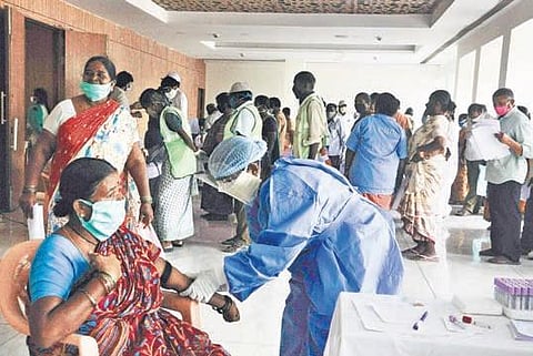 Medical teams conducting blood tests on sanitation workers at Tummalapalli Kalashetram in Vijayawada | Prasant Madugula
