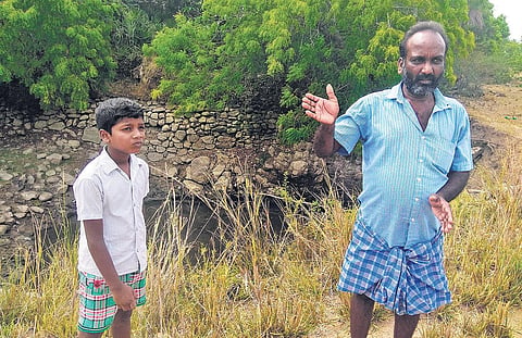 Ramesh, farmer from Malaipalayam, near a contaminated irrigation well. He says he quit farming and now works as a cable TV operator (Photo | EPS)