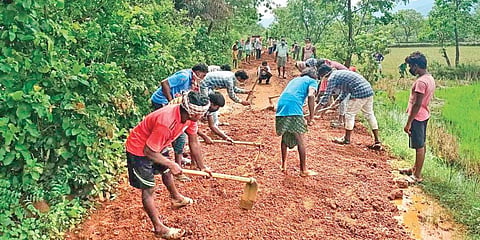 Residents of Hariharpur repairing the village road. (Photo| EPS)