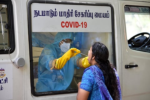 Medical team of mobile hospital taking out swap test at Police quarters at Kilpauk in chennai on Tuesday. (Photo | R Sathish Babu/EPS)