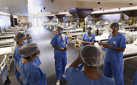 Healthcare workers attend a briefing inside the newly modified isolation ward at Shehnai Banquet Hall opposite the LNJP Hospital to take care of COVID-19 patients in New Delhi Thursday June 25 2020. (Photo | PTI)