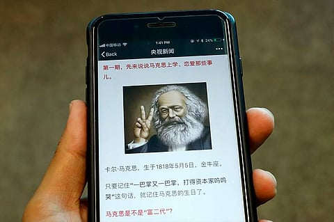 An illustration of Karl Marx making a trendy v-for-victory sign with two fingers. (Photo| AP)