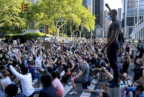 A group of protesters take a knee while marching in lower Manhattan, Saturday, June 6, 2020, in New York. (Photo | AP)