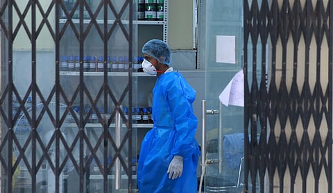 Medical staff wearing PPE rest at a testing centre which provides rapid antigen testing for COVID-19. (Photo | Shekhar Yadav, EPS)