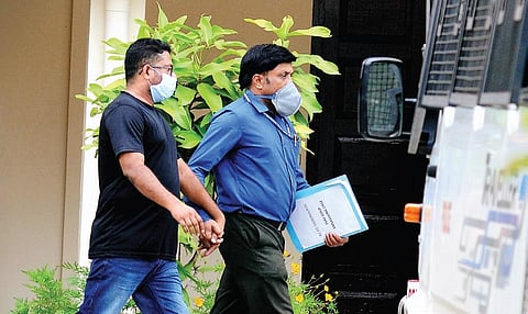Gold smuggling accused Sandeep Nair being brought to the NIA Court in Kochi on Monday | A Sanesh