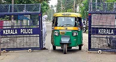 With fear of community spread lingering over Chellanam, a police official clad in a PPE is seen on the road leading to the coastal area | Albin Mathew