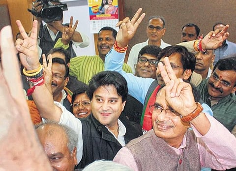 BJP leader Jyotiraditya Scindia, flanked by former CM Shivraj Singh Chouhan, in Bhopal | PTI