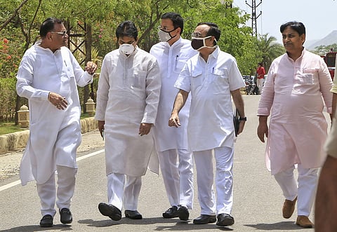 Senior Congress leaders Randeep Surjewala C KC Venugopal Avinash Pandey Ajay Maken and other leaders with newly elected Rajasthan Congress President Govind Singh Dotasara R after a MLA's meeting at a hotel in Jaipur. (Photo PTI)