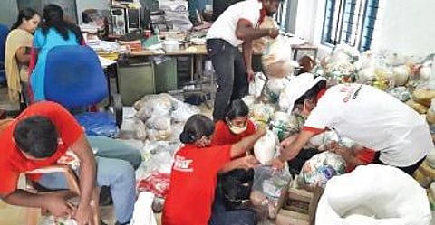 Youth Action Force volunteers busy packing food items