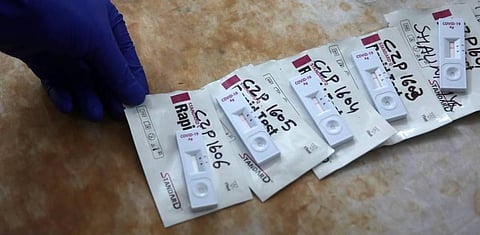 A medical lab technician collects swab samples for coronavirus COVID-19 Rapid Antigen detection testing in New Delhi on Saturday. (Photo | Shekhar Yadav/EPS)