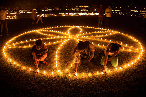 Ayodhya: People lighting earthen lamps on banks of River Saryu during Deepotsav Diwali celebrations in Ayodhya, Uttar Pradesh. (Photo | PTI)