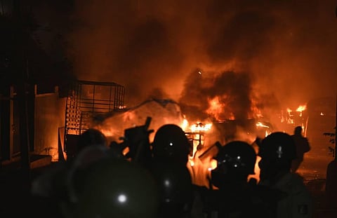 Police vehicles were torched in front of DJ Halli police station in Bengaluru. (Photo | Vinod Kumar T, EPS)