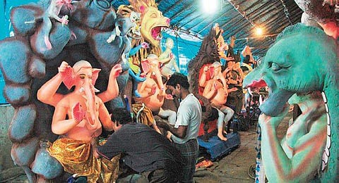 Workers making lord Ganesh idols ahead of Ganesh Chaturti at Chaderghat, Hyderabad. (Photo | S Senbagapandiyan, EPS)
