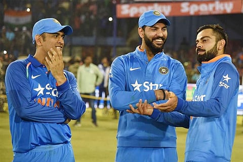 Indian skipper Virat Kohli (L) having a casual chat with Yuvraj Singh (C) and MS Dhoni (Photo | AFP))