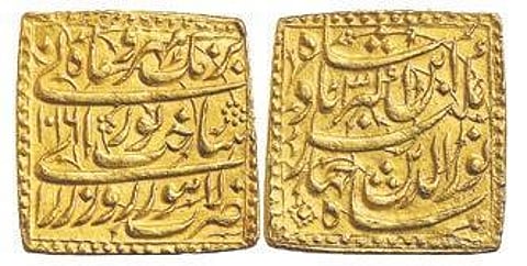 The square gold coins, which weigh around 14 grams each and have poetic couplet on the reverse, were minted in Lahore in 1607.