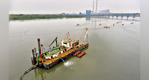 A dredging boat engaged in clearing fly ash and layers of silt from Ennore Creek in Chennai. (Photo | Debadatta Mallick, EPS)