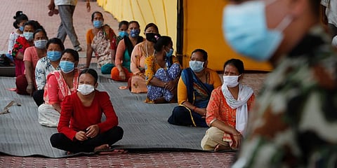 Nepalese women who have travelled outside the Kathmandu valley wait to give swab samples for COVID-19 test in Kathmandu. (Photo | AP)