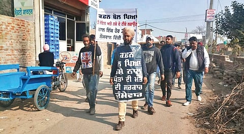 Mukhtiar Singh (c) walks door-to-door speaking against drugs. | Express