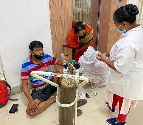 Biswanath being treated on the veranda of the isolation ward of MKCGMCH | EXPRESS