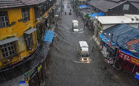 Vehicles ply on a waterlogged street during heavy rains at Byculla area in Mumbai Wednesday Aug. 5 2020. (Photo | PTI)