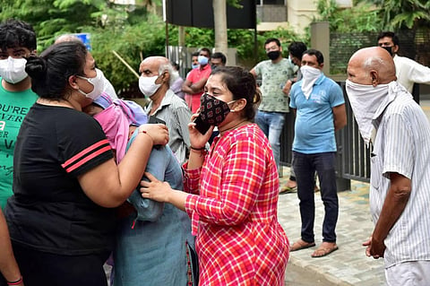 Kins of the victims react outside Shrey hospital after a major fire broke out in it in the wee hours in Ahmedabad Thursday Aug 6 2020. (Photo | PTI)