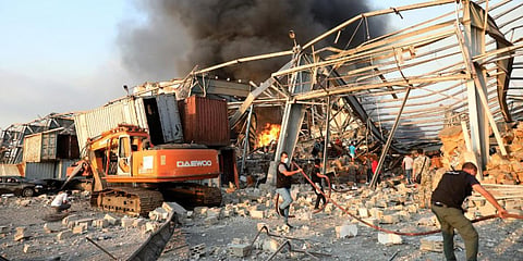 Lebanese firefighters work at the scene of an explosion in the Lebanese capital Beirut on August 4. (File Photo | AFP)