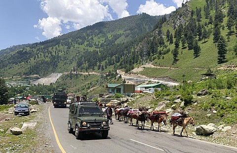 An Indian army convoy moves on the Srinagar- Ladakh highway at Gagangeer, north-east of Srinagar, Thursday, June 18, 2020. (Photo | AP)