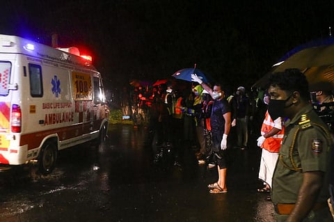 An ambulance carrying injured passengers leaves for a hospital after an Air India Express jet. (Photo | AFP)