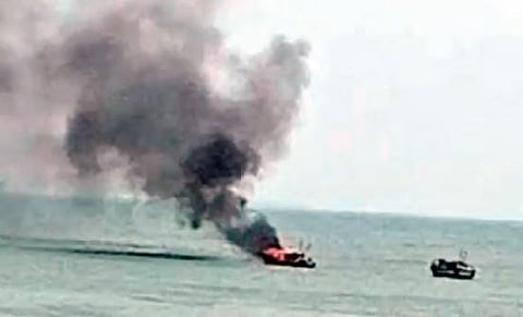A fishing boat catches fire mid-sea in Vizag. (Photo | EPS)