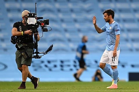 David Silva (R) waves into the lens of a television camera operator. (Photo | AFP)