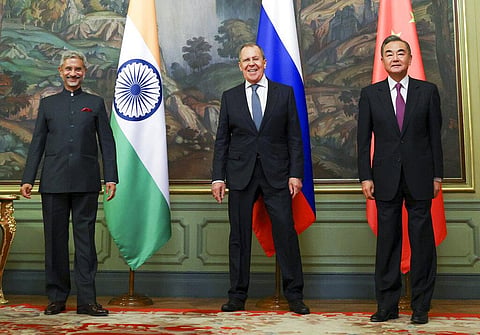 India's Foreign Minister S. Jaishankar, left, Russia's Foreign Minister Sergey Lavrov, and China's Foreign Minister Wang Yi, pose for a photo on the sidelines of SCO Summit.