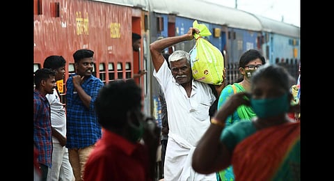 Unmindful of restrictions for visitors at stations during pandemic, many elderly people travelling with heavy luggage in special trains at Tambaram Railway Station . (Photo | Ashwin prasath, EPS)