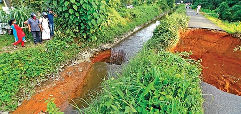 The four-metre-deep sinkhole developed in the Kuttiyelli canal of Periyar Valley Irrigation Project at Mudakuzha panchayat in Perumbavoor. The adjacent Parapanamkuzhi Bund Road has also caved in | Aru
