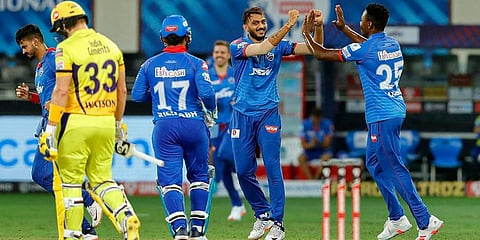Delhi Capitals bowler Axar Patel celebrates with teammates after dismissing Chennai Super Kings batsman Shane Watson during IPL match at Dubai International Cricket Stadium. (Photo | PTI)