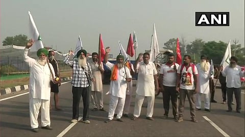 Farmers, under the aegis of Bharatiya Kisan Union and Revolutionary Marxist Party of India (RMPI), block Amritsar-Delhi National Highway near Phillaur in Jalandhar. (File Photo | ANI Twitter)