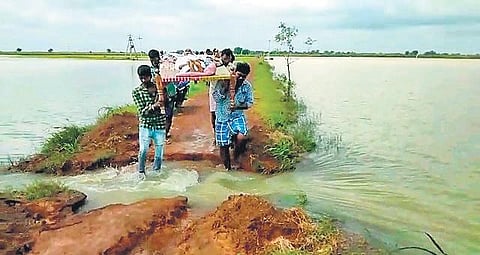 Brahmanapalle villagers carrying the unwell man on a cot who later succumbed to his illness. (Photo | Express)