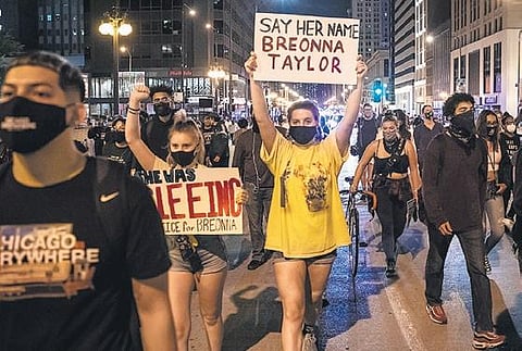 Protesters march in Chicago against the decision of a Kentucky grand jury not to slap manslaughter charges on police officers involved in the fatal shooting of Breonna Taylor (Photo | AP)