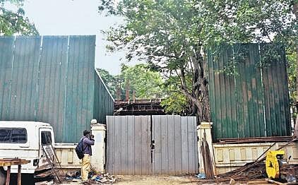 I-T dept officials stuck a notice outside the 22000 sqft land opposite Veda Nilayam in Chennai on Wednesday | ashwin prasath