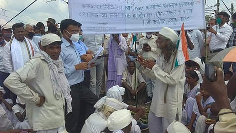 Members of Tana Bhagat group protesting at the railway tracks. (Photo | Express)