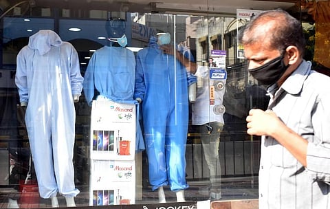 Mannequins at a readymade garments showcase hazmat suits instead of the usual everyday wear in Hyderabad. (Photo | S Senbagapandiyan/EPS)