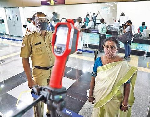 Kochi Metro reopened on Monday with the required Covid-19 protocol in place. A commuter under going thermal scanning at a metro station , Arun Angela