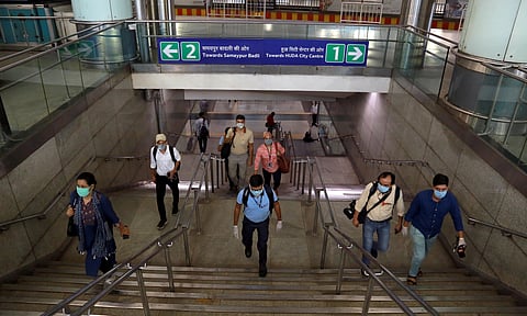 Commuters travel in metro train as Delhi Metro resumes operations in a graded manner in New Delhi on Monday. (Photo | EPS/Shekhar Yadav)