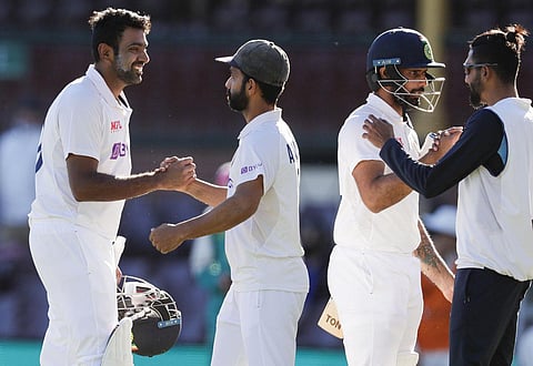 India's Ravichandran Ashwin, left, is congratulated by his captain Ajinkya Rahane as Hanuma Vihari is congratulated by teammate Mohammed Siraj. (Photo | AP)