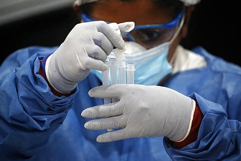 A healthcare worker tests for COVID-19, in Buenos Aires, Argentina, Friday, Jan. 8, 2021. (Photo | AP)