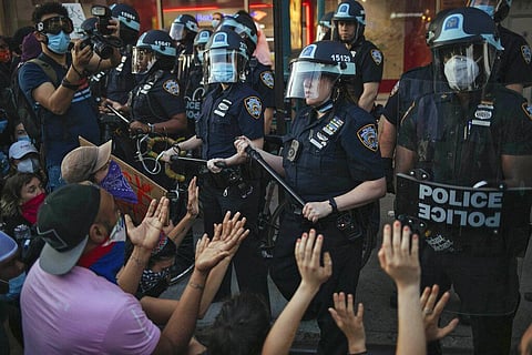 New York City Police facing off with activists during a protest march in the Bedford-Stuyvesant section of the Brooklyn borough of New York. (Photo | AP)