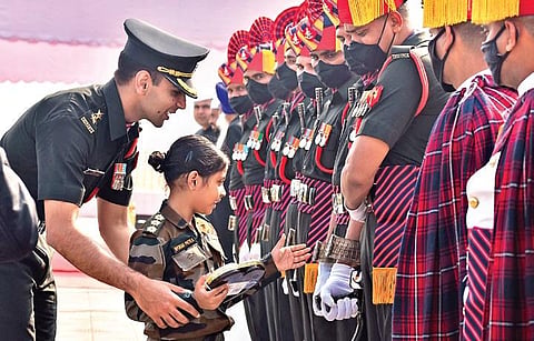Dressed in an Army uniform, seven-year-old Nyorah Patra interacts with soldiers, on the 73rd Army Day, at Parade Ground in Secunderabad on Friday | S Senbagapandiyan